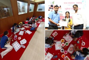 Children spread colors in the 'School of Happiness'; block printing activity enhances children's creative skills.