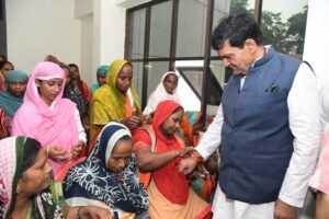 Women sanitation workers tied Rakhis to the Urban Development Minister.