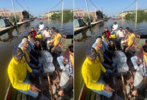 Civil Defence stands with flood victims in Faizullaganj; distributes relief supplies.